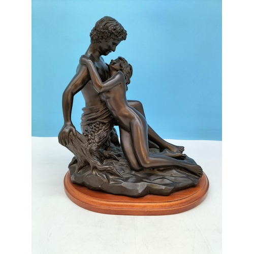 225 - Bronze Effect Resin 'Lovers Embrace' Figure on Plinth. 27cm High, 24cm x 20cm.