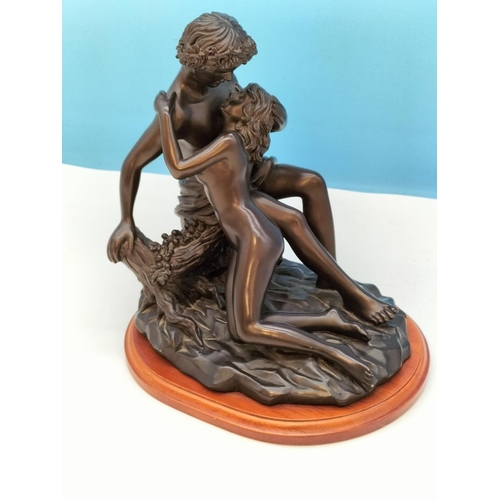 225 - Bronze Effect Resin 'Lovers Embrace' Figure on Plinth. 27cm High, 24cm x 20cm.