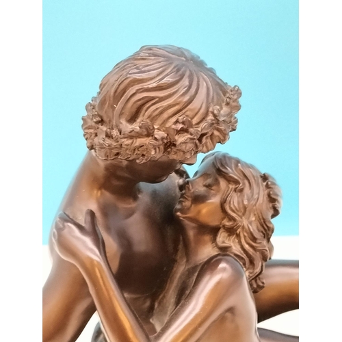 225 - Bronze Effect Resin 'Lovers Embrace' Figure on Plinth. 27cm High, 24cm x 20cm.