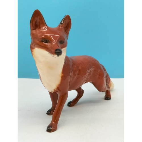 141 - Beswick Figure of a Fox. 14cm High x 24cm.