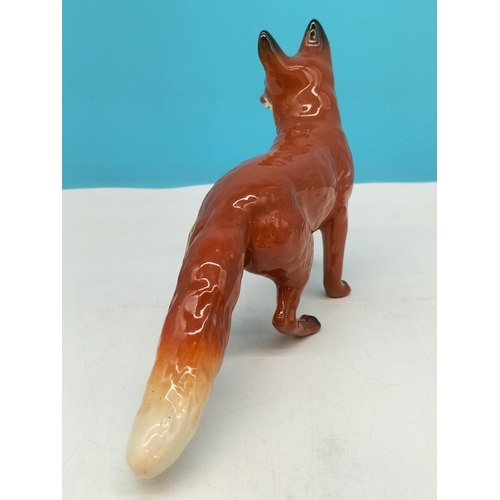 141 - Beswick Figure of a Fox. 14cm High x 24cm.