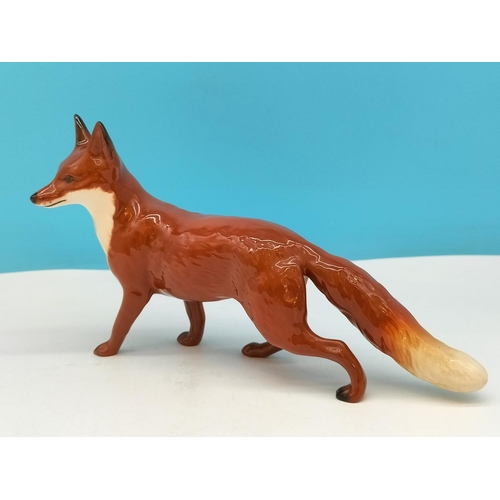 141 - Beswick Figure of a Fox. 14cm High x 24cm.