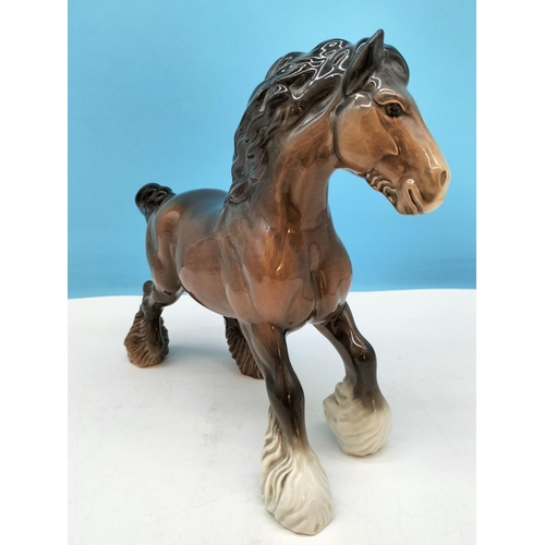 176 - Beswick Figure of a Cantering Shire Horse. 22cm High x 26cm.