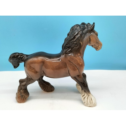 176 - Beswick Figure of a Cantering Shire Horse. 22cm High x 26cm.