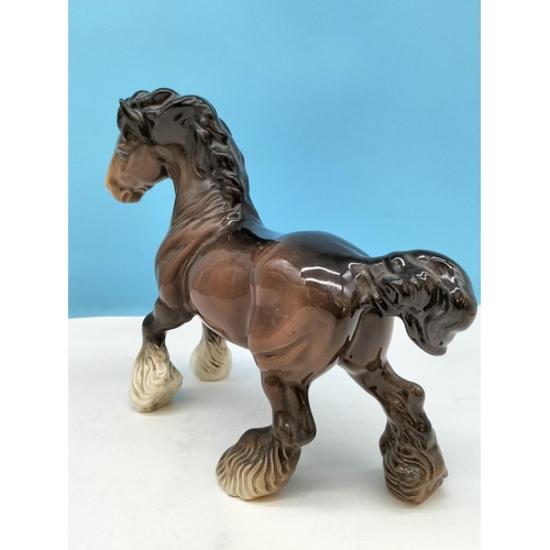 176 - Beswick Figure of a Cantering Shire Horse. 22cm High x 26cm.