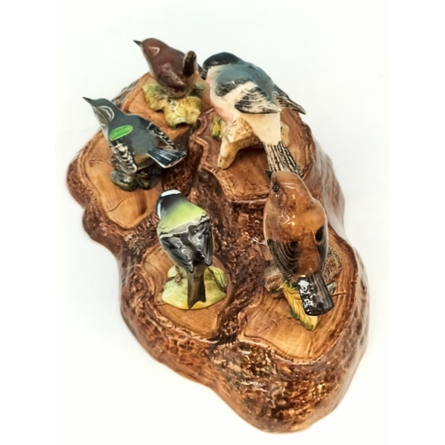 42 - Beswick Bird Figures (5) on Stand 32cm x 19cm x 6cm. A/F Chip to Front of Base of Stand.