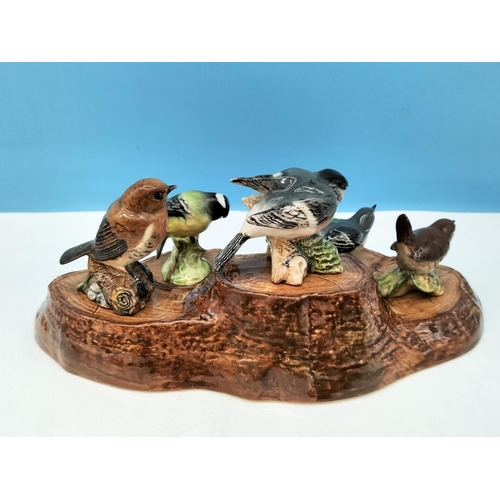 42 - Beswick Bird Figures (5) on Stand 32cm x 19cm x 6cm. A/F Chip to Front of Base of Stand.