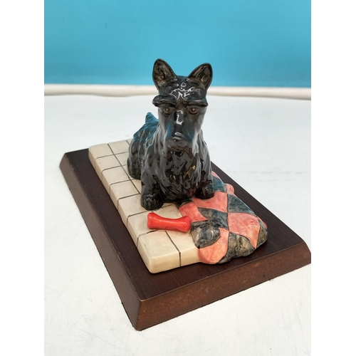 220 - Royal Doulton Figure of a Scottish Terrier RDA 52 on Plinth. 10cm High, 17cm x 11cm