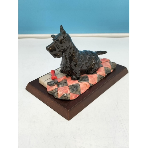 220 - Royal Doulton Figure of a Scottish Terrier RDA 52 on Plinth. 10cm High, 17cm x 11cm