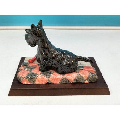 220 - Royal Doulton Figure of a Scottish Terrier RDA 52 on Plinth. 10cm High, 17cm x 11cm