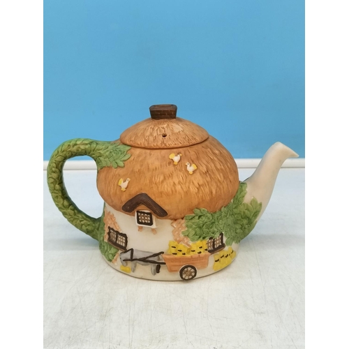 234 - Collection of Novelty Teapots