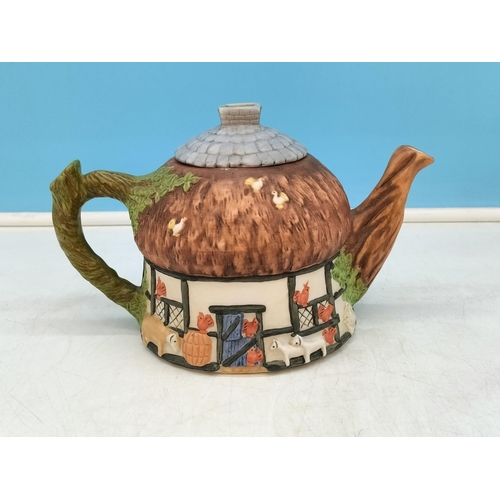 234 - Collection of Novelty Teapots