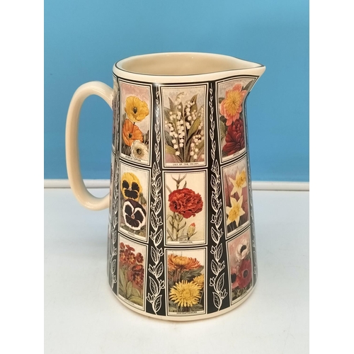 348 - Amberglade Derbyshire Pottery Floral Jug. 22cm High.