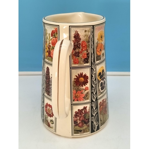 348 - Amberglade Derbyshire Pottery Floral Jug. 22cm High.