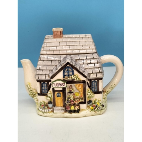 597 - Village Shop Teapots (4) plus Village Shop Storage Jar. Tallest 22cm. Light Chip to 2 Spouts and Bas... 