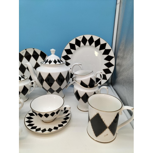 249 - Hudson Middleton Fine Bone China Tea and Coffee Pieces (19) in a Harlequin Pattern.