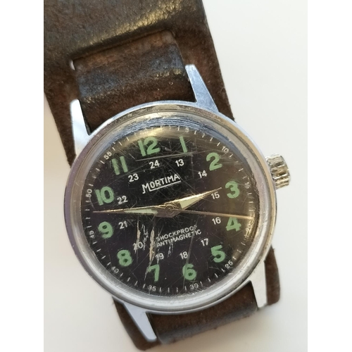 554 - 1960's Mortima Military Style Gents Watch. Scratches to Glass.