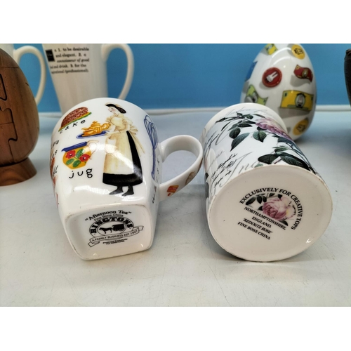210 - Wooden Puzzle Rugby Ball, Bowl, Money Box plus a Collection of Mugs to include Aynsley, Cadbury, Win... 