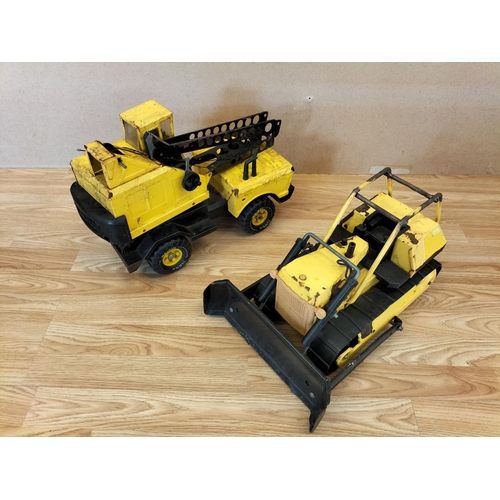 60A - 2 x Play Worn Tonka Toys, T9 Bulldozer and Mighty Crane. Largest 32cm High, 43cm x 21cm.