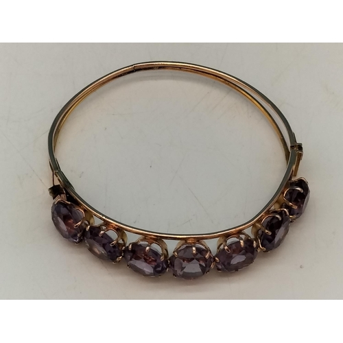 1 - 14ct Gold and Amethyst Bangle. Total Weight 15.5 Grams. With Box.