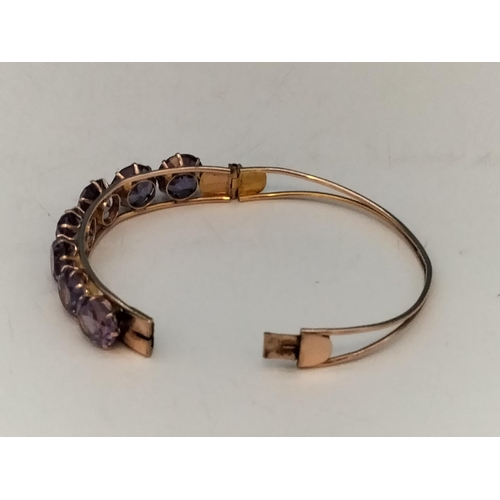 1 - 14ct Gold and Amethyst Bangle. Total Weight 15.5 Grams. With Box.