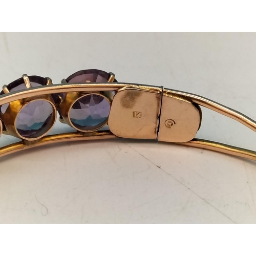 1 - 14ct Gold and Amethyst Bangle. Total Weight 15.5 Grams. With Box.