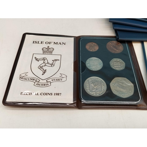 105 - 12 x British First Decimal Coin Sets plus 1 x Isle of Man Coin Sets.