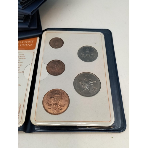 105 - 12 x British First Decimal Coin Sets plus 1 x Isle of Man Coin Sets.