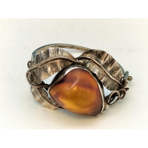 357 - .900 Silver Bangle with Large Natural Amber Centre Stone.