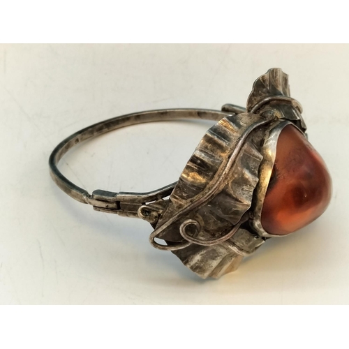 357 - .900 Silver Bangle with Large Natural Amber Centre Stone.