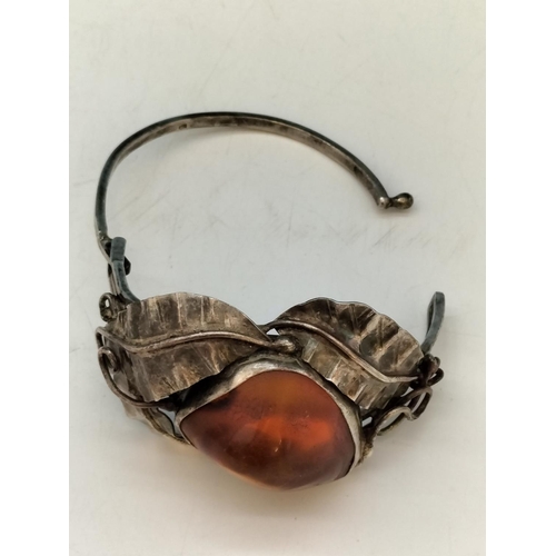 357 - .900 Silver Bangle with Large Natural Amber Centre Stone.