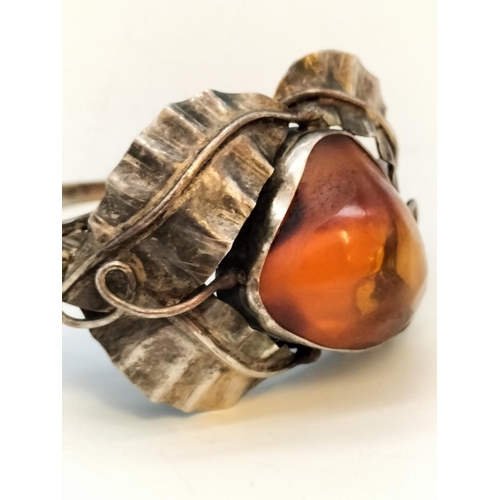 357 - .900 Silver Bangle with Large Natural Amber Centre Stone.