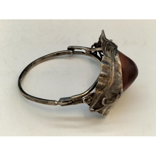 357 - .900 Silver Bangle with Large Natural Amber Centre Stone.