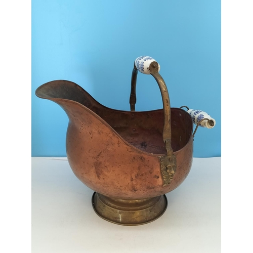 38 - Vintage Copper Helmet Coal Scuttle with Delft Porcelain Handles. 33cm High x 45cm. One Handle A/F.