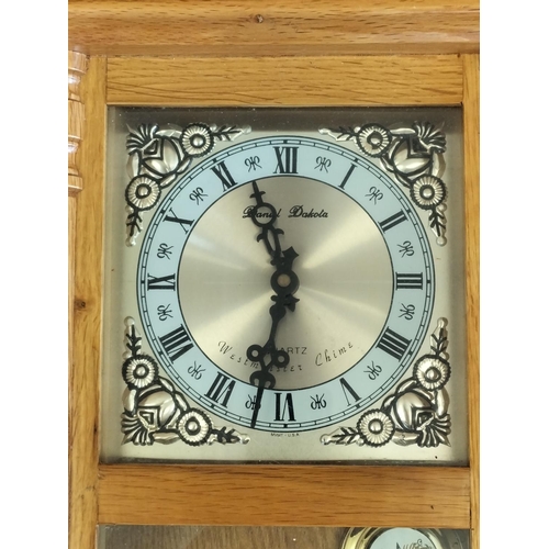 542 - Daniel Dakota Westminster Chime Wall Clock. 58cm x 26cm x 11cm.