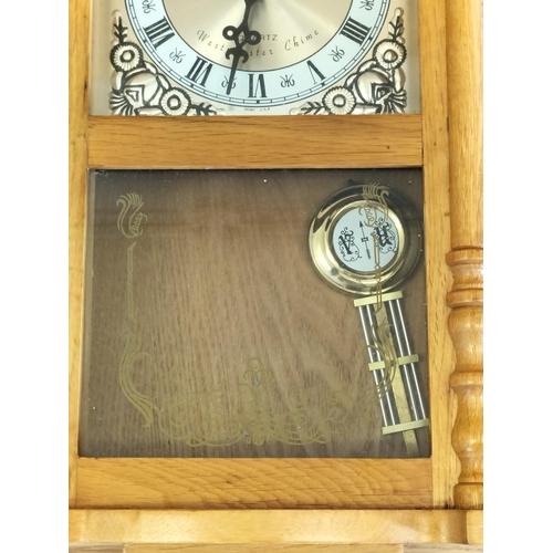 542 - Daniel Dakota Westminster Chime Wall Clock. 58cm x 26cm x 11cm.