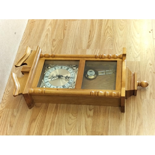 542 - Daniel Dakota Westminster Chime Wall Clock. 58cm x 26cm x 11cm.