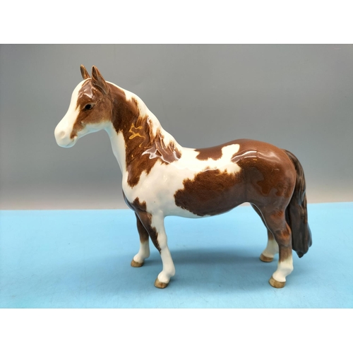 212 - Beswick Figure of a Skewbald Pony. 17cm High x 20cm.