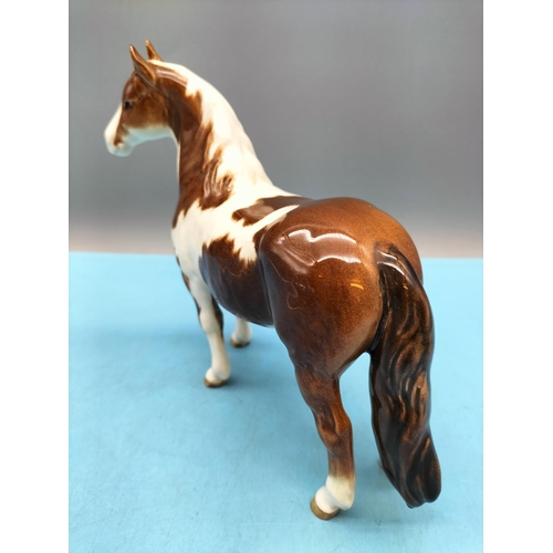 212 - Beswick Figure of a Skewbald Pony. 17cm High x 20cm.