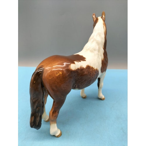 212 - Beswick Figure of a Skewbald Pony. 17cm High x 20cm.