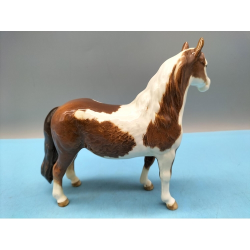 212 - Beswick Figure of a Skewbald Pony. 17cm High x 20cm.