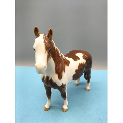 212 - Beswick Figure of a Skewbald Pony. 17cm High x 20cm.