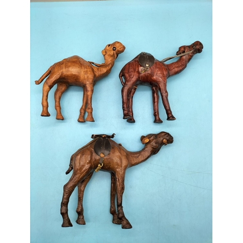392 - 3 x Leather Camels. Largest 18cm High x 23cm.