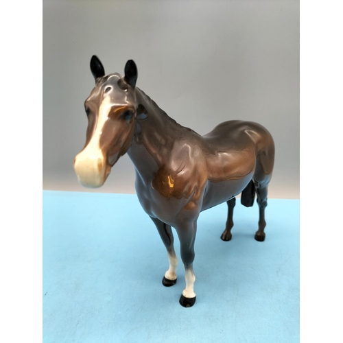 396 - Beswick Figure of a Brown Horse. 20cm High x 24cm. Small Chip to Front Hoof.