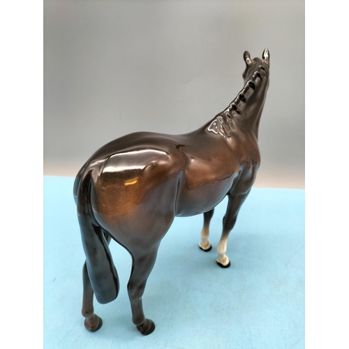 396 - Beswick Figure of a Brown Horse. 20cm High x 24cm. Small Chip to Front Hoof.