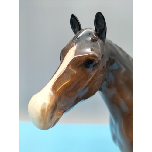 396 - Beswick Figure of a Brown Horse. 20cm High x 24cm. Small Chip to Front Hoof.