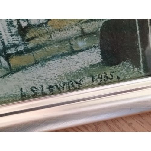 131 - Framed and Mounted L.S.Lowry Print 'A Lancashire Village' 55cm x 42cm. Collection Only.