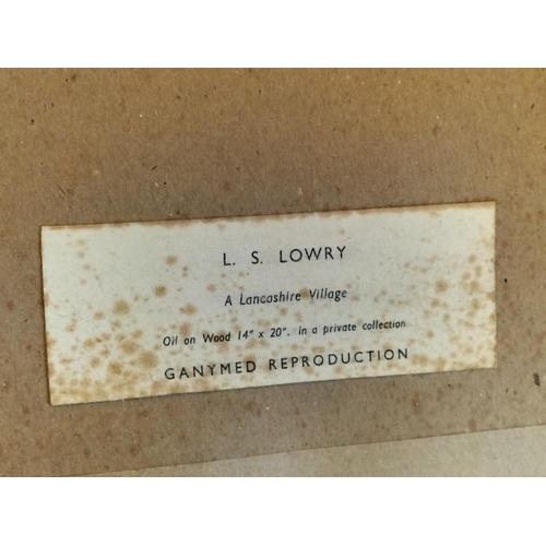 131 - Framed and Mounted L.S.Lowry Print 'A Lancashire Village' 55cm x 42cm. Collection Only.