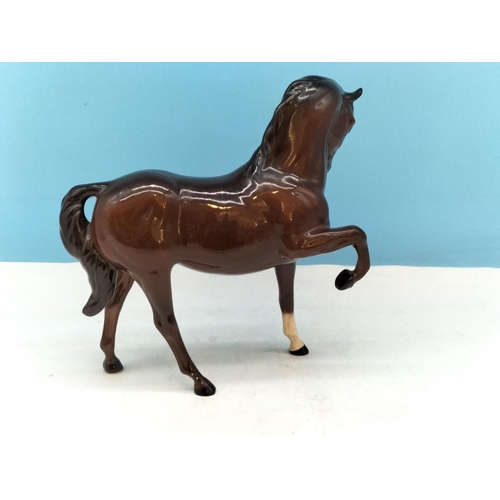 136 - Royal Doulton Prancing Horse Figure. 19cm High x 21cm. A/F Nip to Hoof.