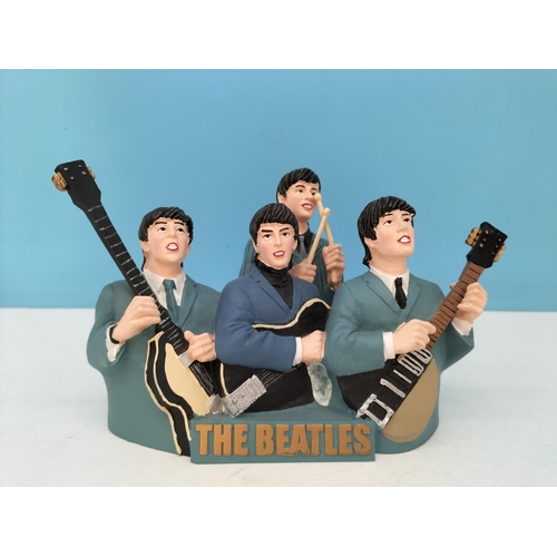 73 - Resin Figure of 'The Beatles'. 13cm High, 20cm x 9cm.